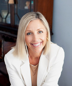 headshot of woman in a suit